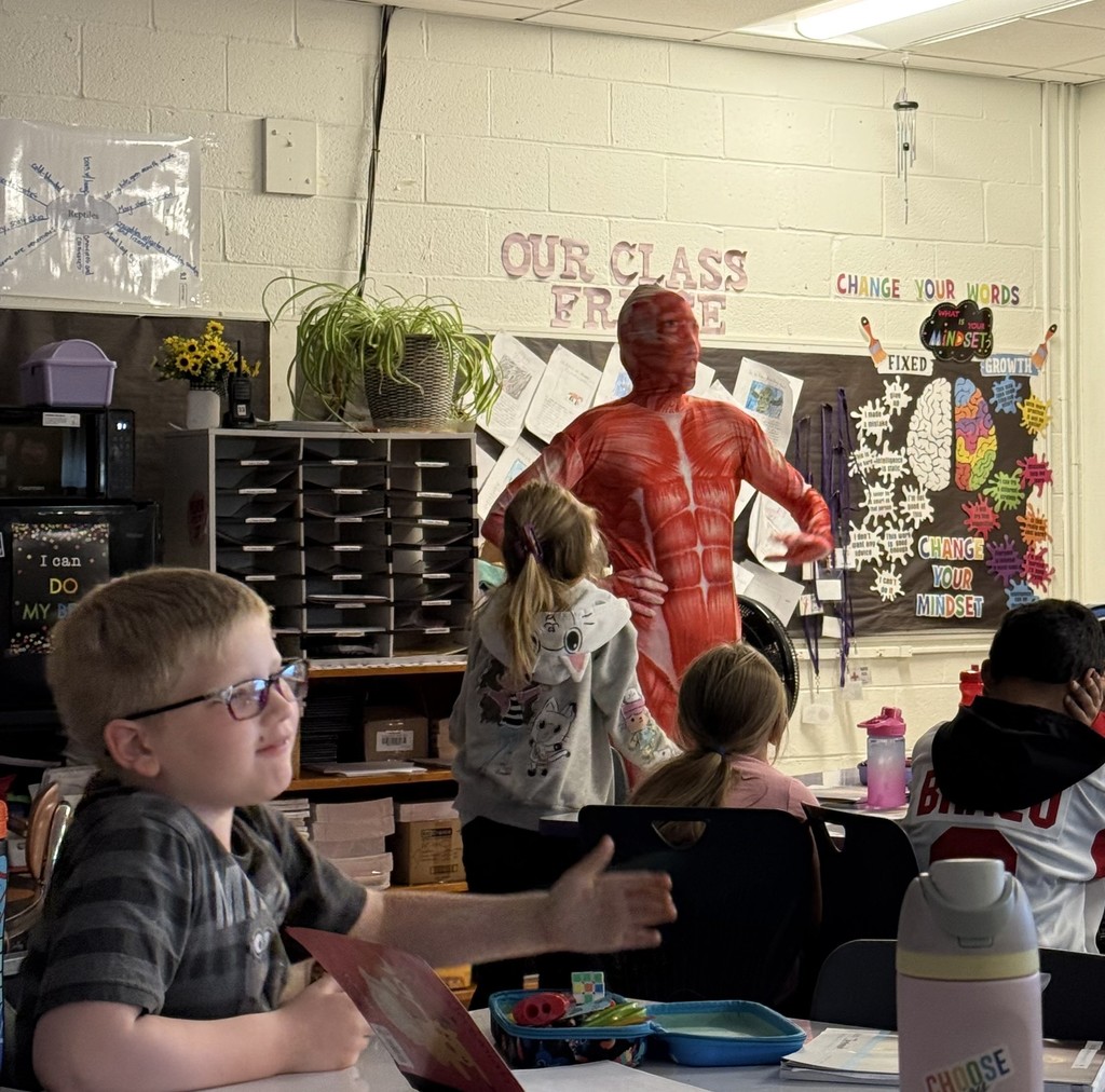 Muscle Woman Visits Third Grade! In Mrs. Preston and Mrs. Frailey’s third-grade class, students are learning all about the systems of the human body! To introduce the muscular system, Mrs. Preston transformed into her alter ego — Muscle Woman! Students made connections between the skeletal and muscular systems, discovering how their bodies move and grow. A big thank-you to our amazing teachers for making learning interactive, engaging, and meaningful for our students! 💜🦁 #LionPride #DrydenElementary #HandsOnLearning