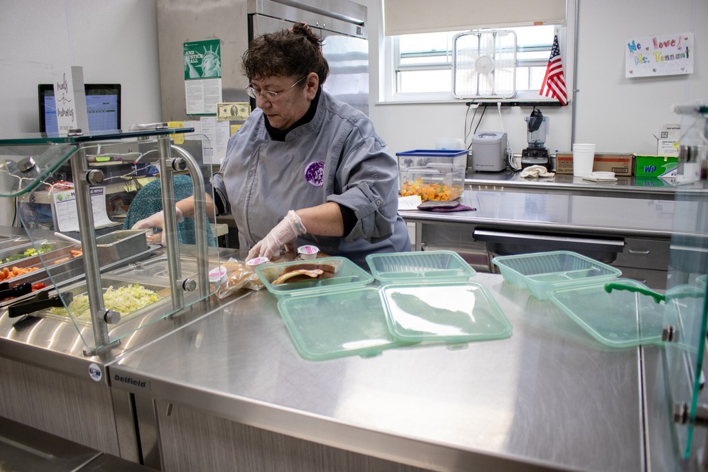 Lunch staff at FES packing lunches for students in reusable containers