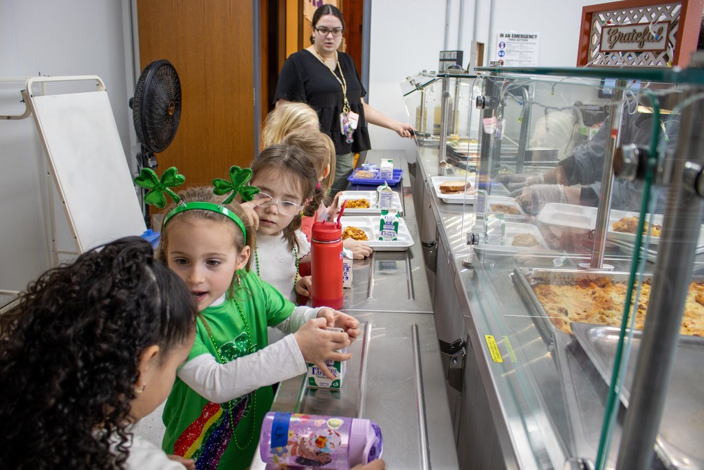 Students at FES chatting in the lunch line