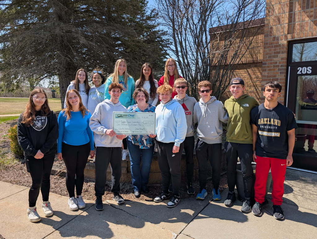group of students receiving a large check