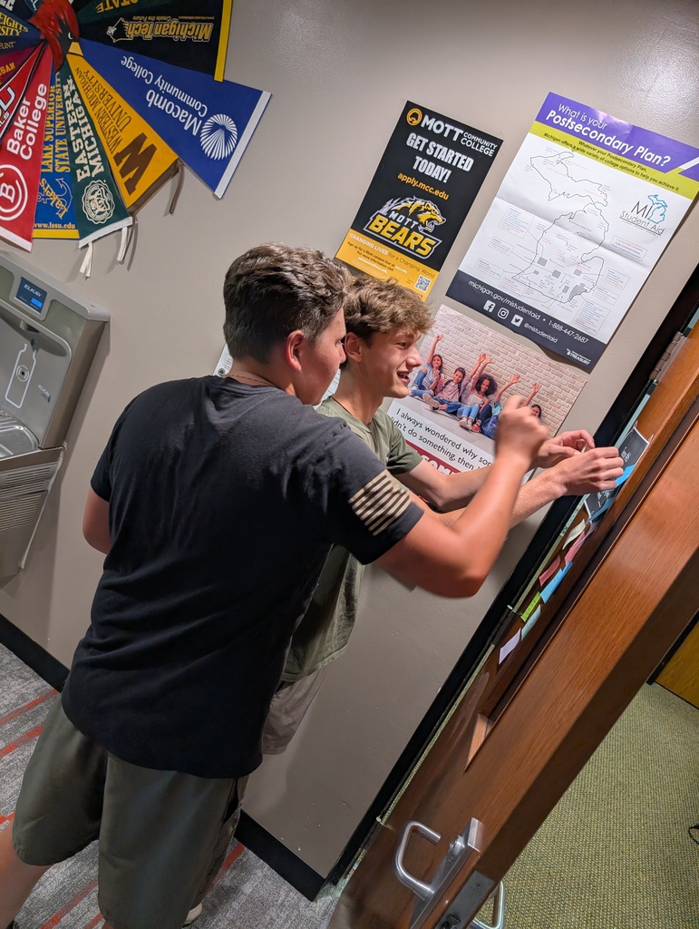 two students working together on a school assignment