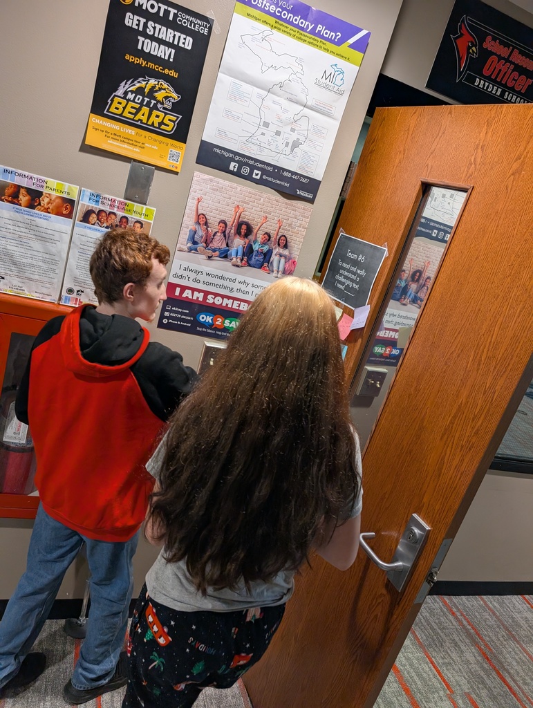 two students working together on a school assignment
