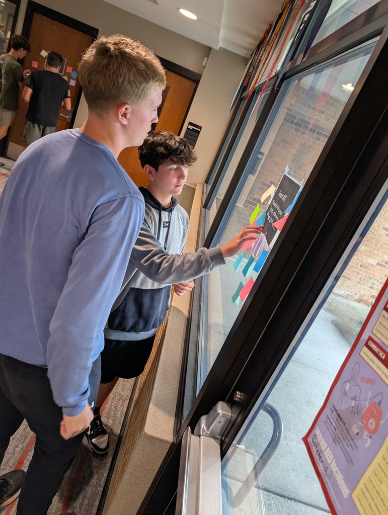 two students working together on a school assignment