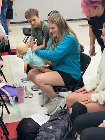 student practicing CPR for training