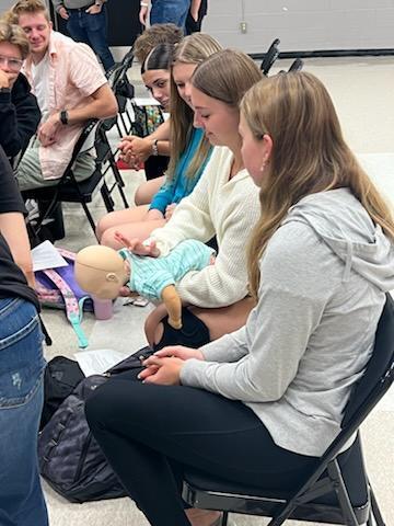 student practicing CPR for training