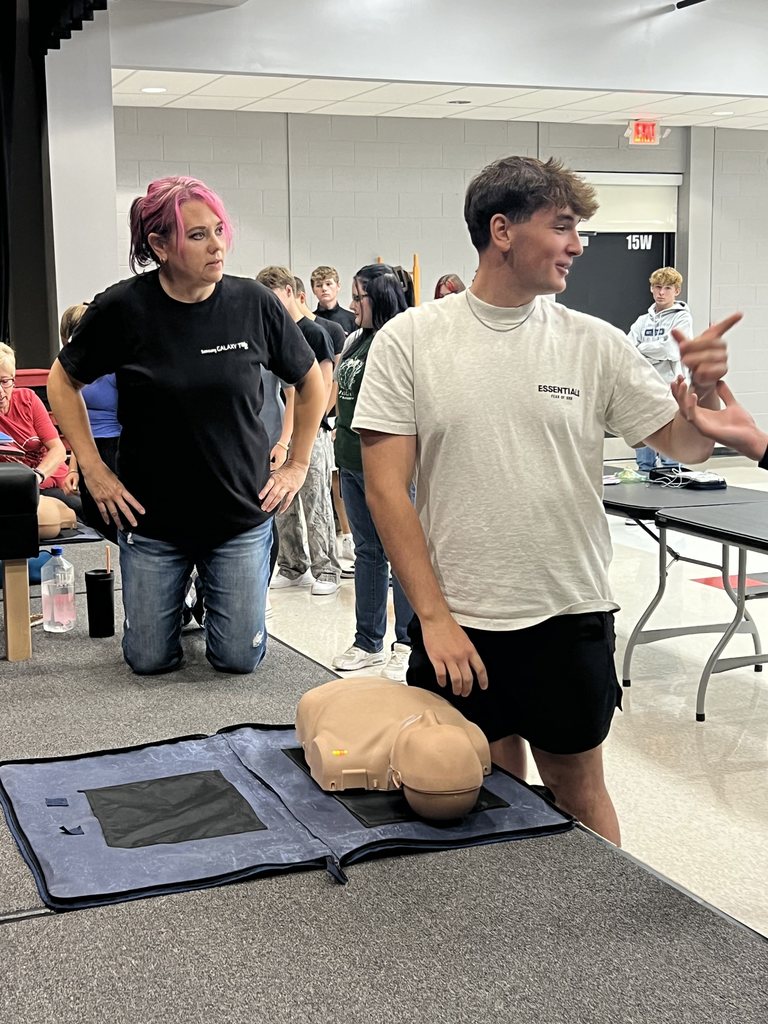 student practicing CPR for training