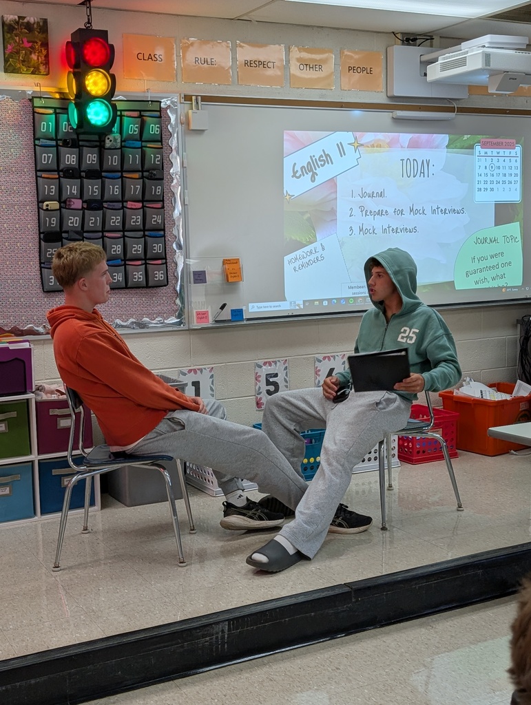 two students participating in a mock job interview