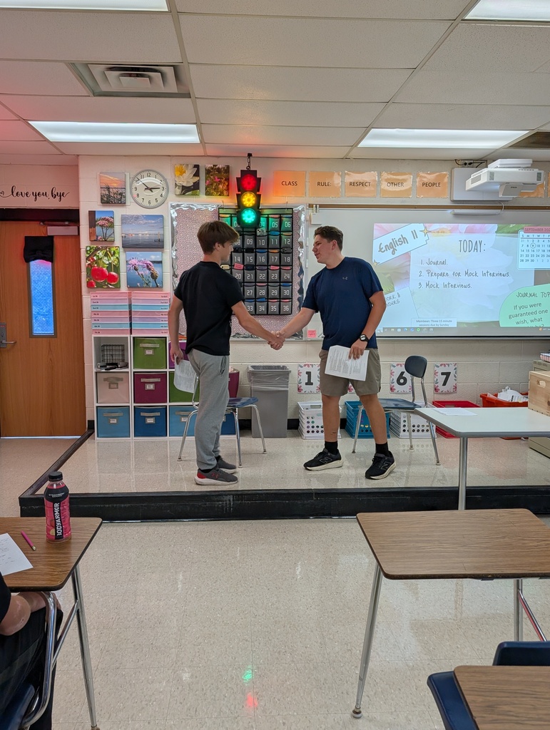 two students participating in a mock job interview