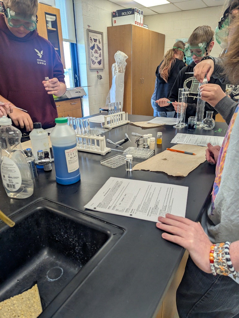 students completing a science experiment