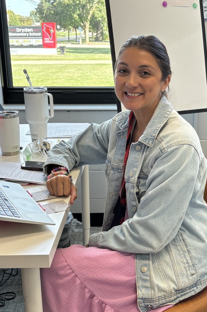 a woman sitting at her desk