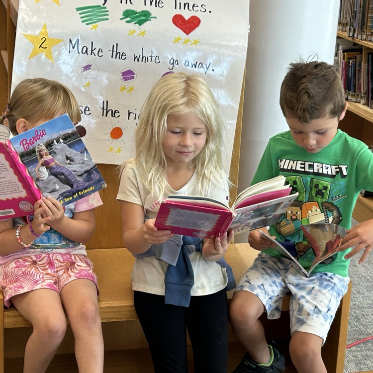 Kindergarteners enjoyed checking settling in to the library and checking out books. #growingreaders #proudcardinal