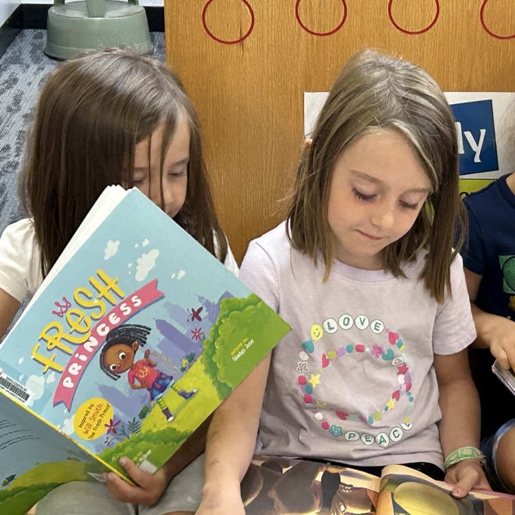 Kindergarteners enjoyed checking settling in to the library and checking out books. #growingreaders #proudcardinal