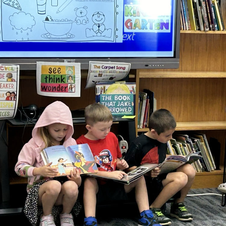 Kindergarteners enjoyed checking settling in to the library and checking out books. #growingreaders #proudcardinal