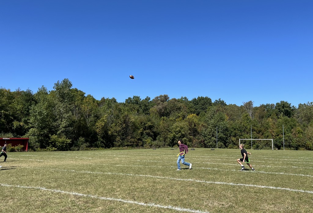 high school students playing flag football