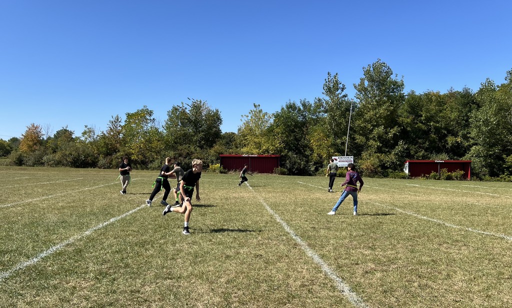 high school students playing flag football