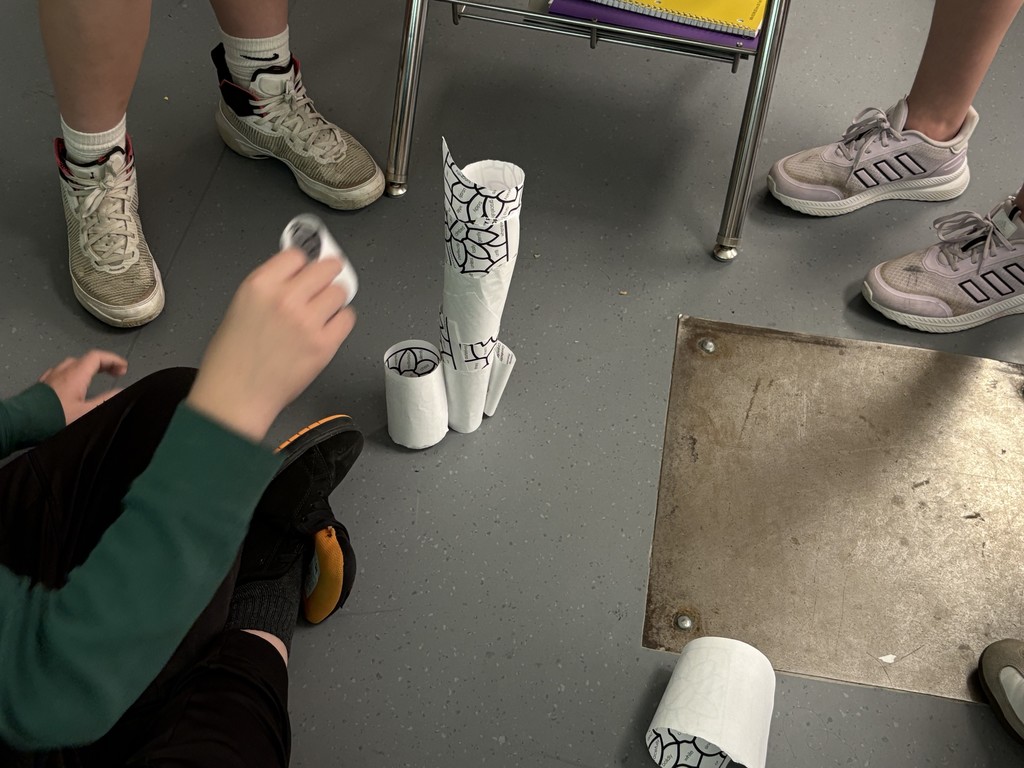 6th grade students are building towers to learn about criteria and constraints. Little do they know, they were given different rubrics, one very vague and the other more detailed. They will all be judged on the same…. The detailed one. This shows how important knowing the criteria and constraints of any project before you start. 