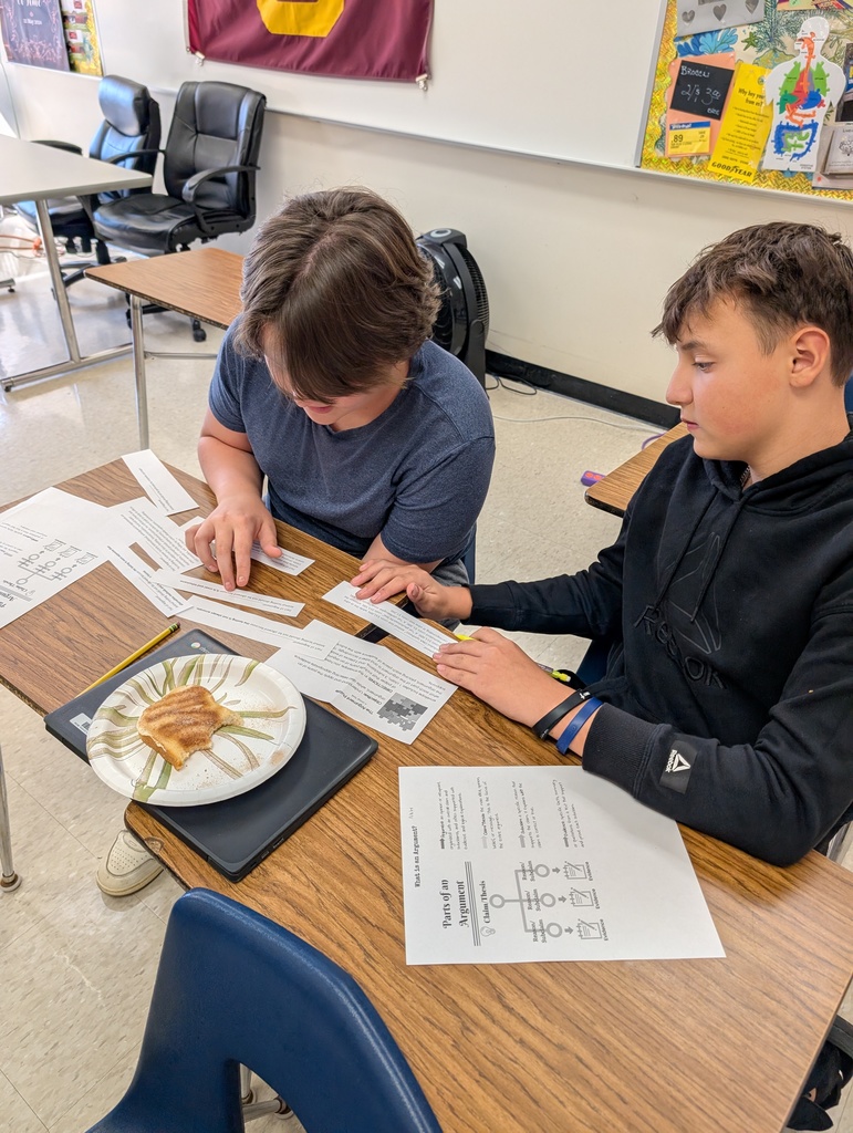 two 8th grade students working together on an assignment