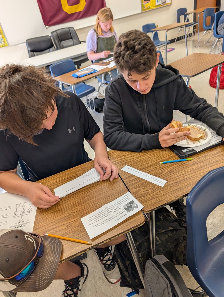 two 8th grade students working together on an assignment