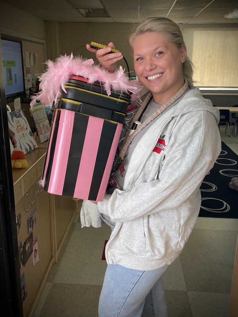 teacher holding a decorated container