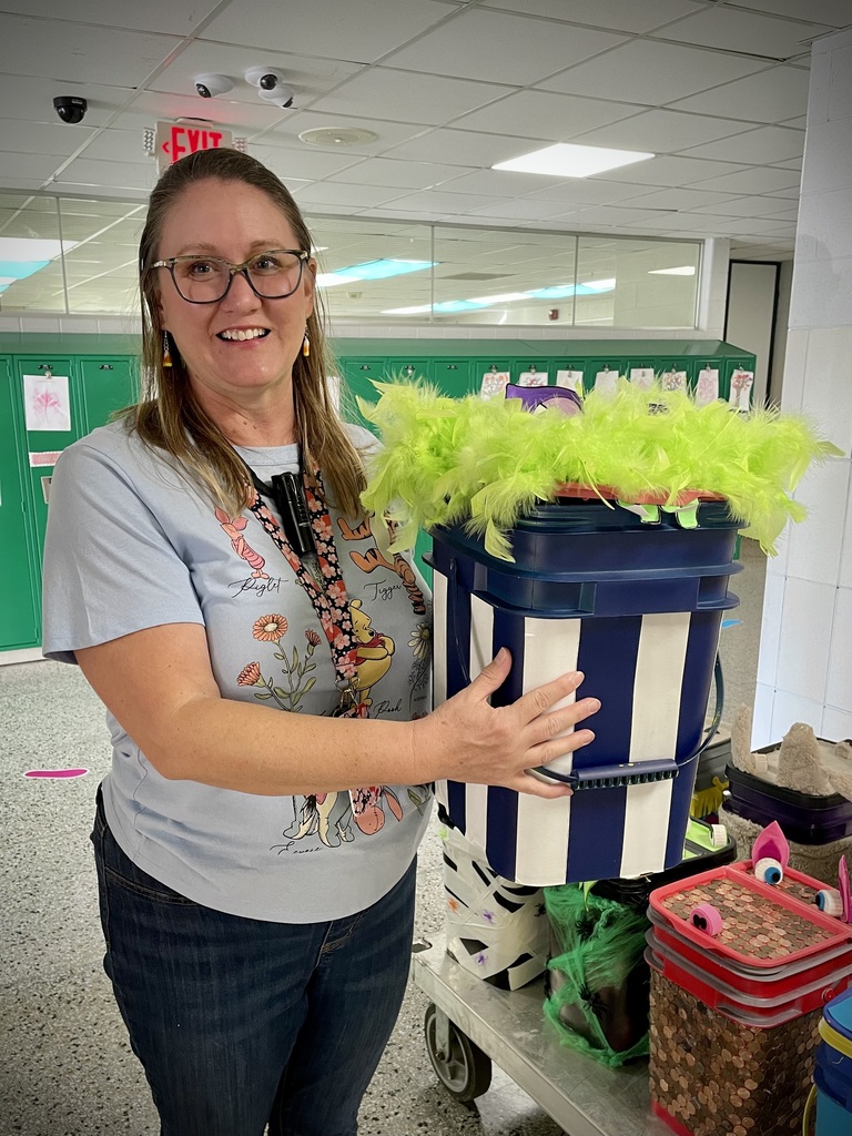 teacher holding a decorated container