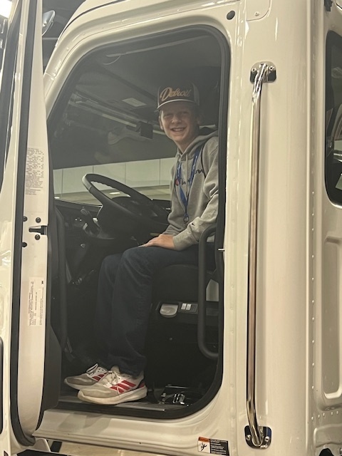 student sitting in driver's seat