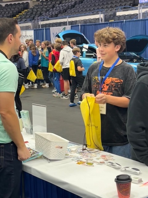 eighth grader talking to an adult