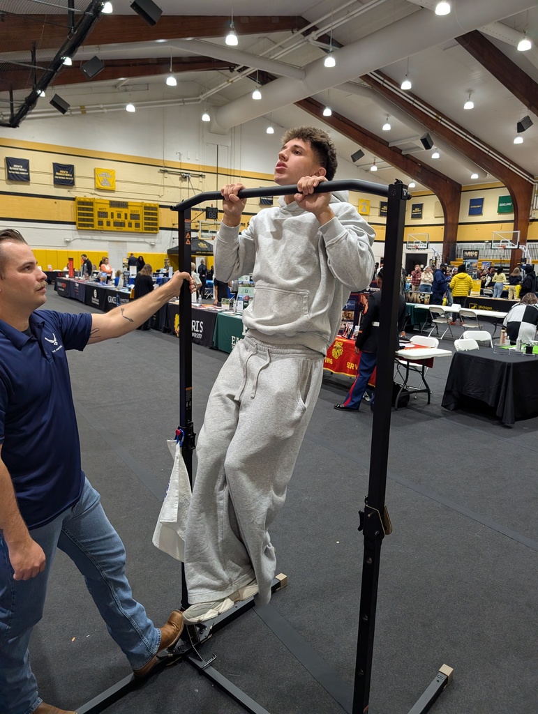 high school student doing a pull up