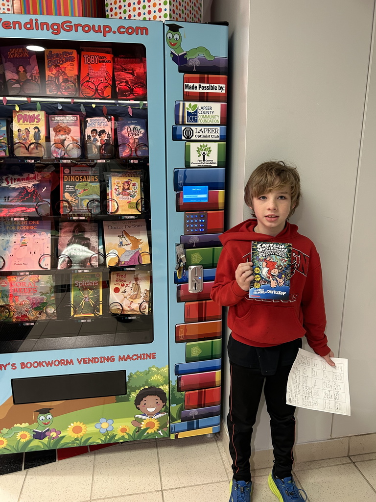 Working our way to 500 Books Before Middle School...and Kyle hit the 100 tier level which earned him a coin for the book vending machine.  #growingreaders #proudcardinal