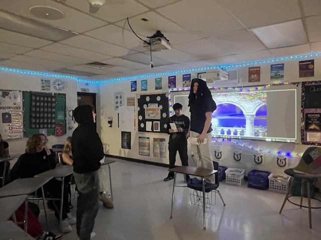 ninth grade students performing the Romeo and Juliet balcony scene in a classroom