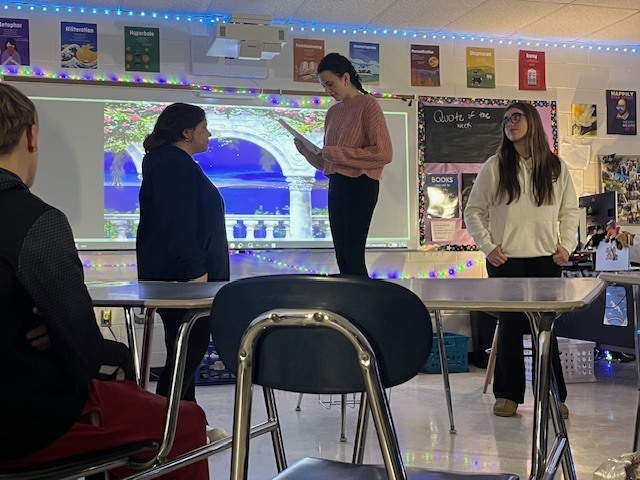 ninth grade students performing the Romeo and Juliet balcony scene in a classroom