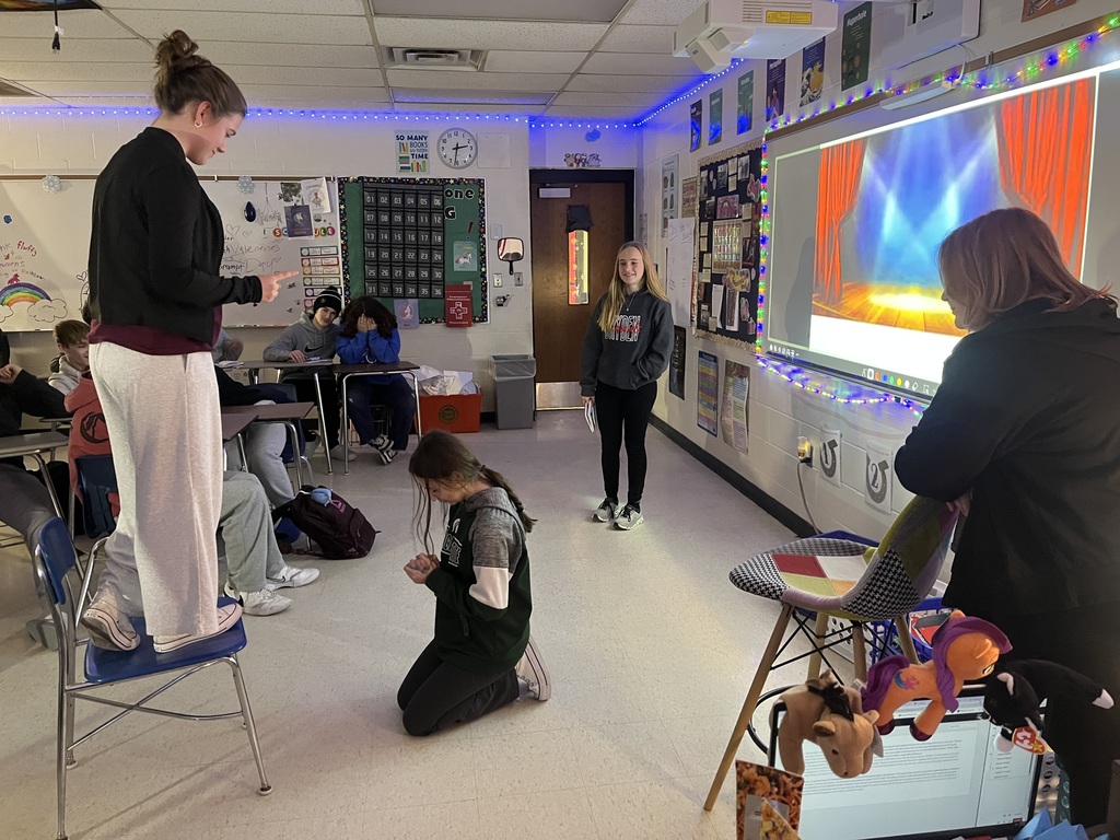 high school students creating a freeze frame of Romeo and Juliet