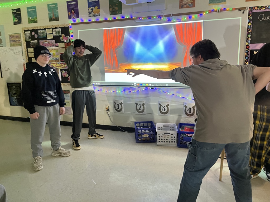 high school students creating a freeze frame of Romeo and Juliet