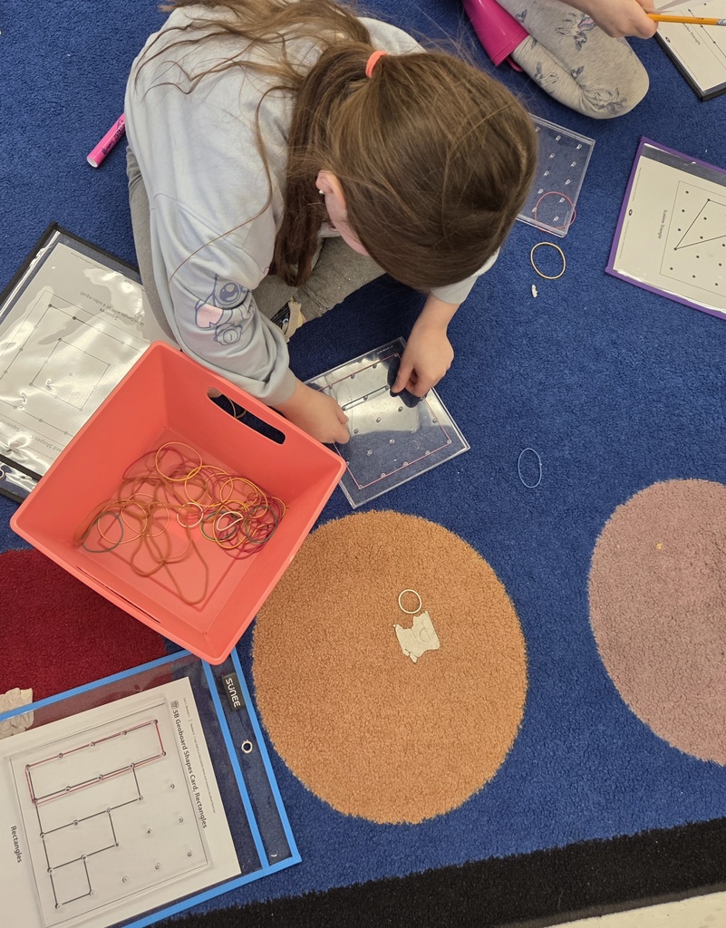 Kindergarten students in Mrs. Hearold's class practice their math skills during Work Places.