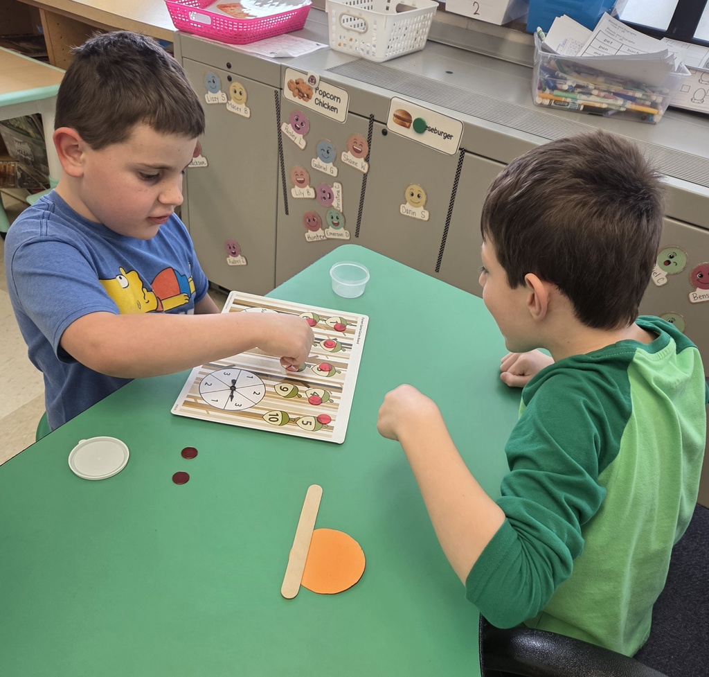 Kindergarten students in Mrs. Hearold's class practice their math skills during Work Places.
