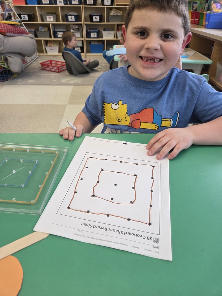 Kindergarten students in Mrs. Hearold's class practice their math skills during Work Places.