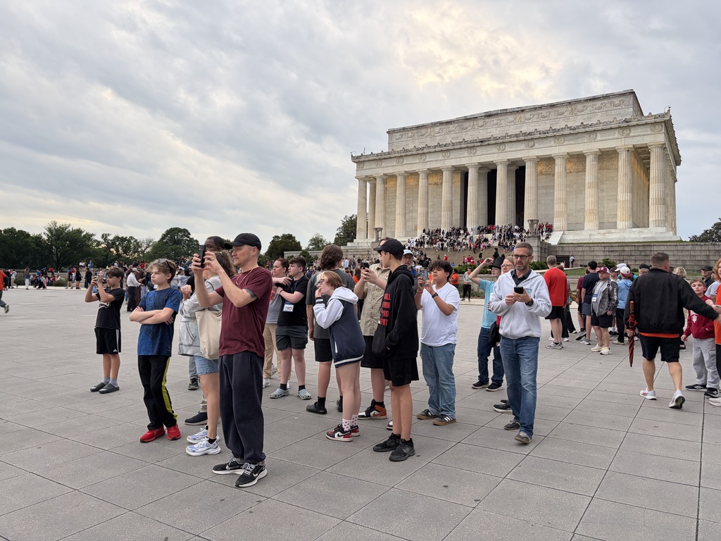 group of people taking photos