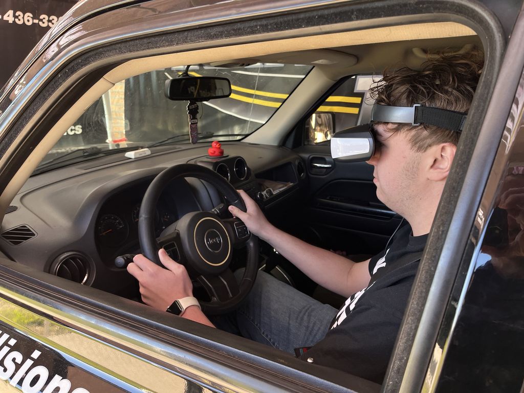 student in driving simulator
