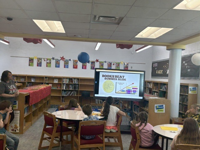 Students in Mrs. Calvert’s class learned about Mrs. Knox’s summer reading challenge and got to shop for their summer take-home books.