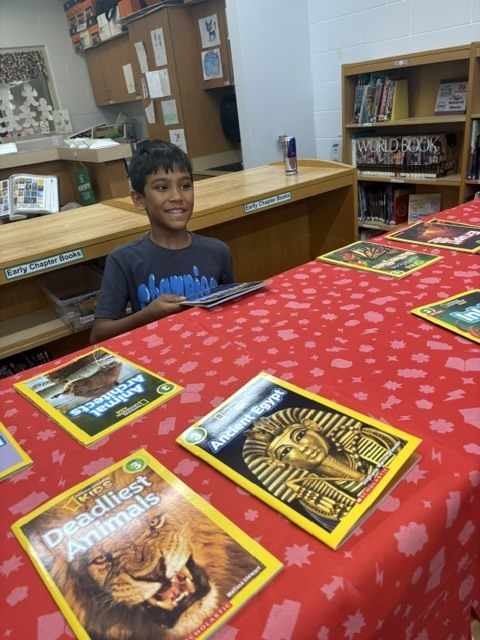 Students in Mrs. Calvert’s class learned about Mrs. Knox’s summer reading challenge and got to shop for their summer take-home books.
