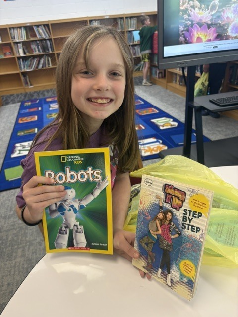 Students in Mrs. Calvert’s class learned about Mrs. Knox’s summer reading challenge and got to shop for their summer take-home books.
