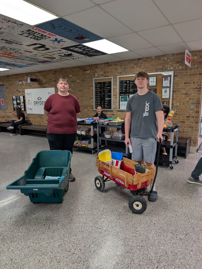 two young men with hand pulled carts