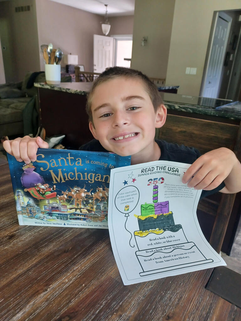 Two more books read in the "Read the USA" Summer Reading Challenge for Joey - a book about Michigan and a book with a state's name in the title.  #growingreaders #proudcardinal