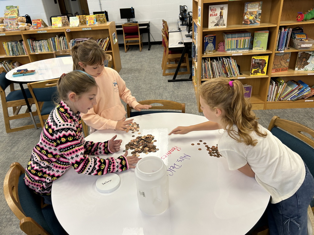 Coin war - students counting coins