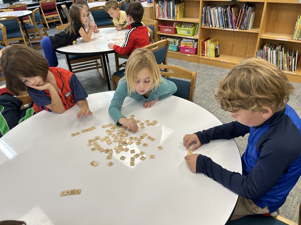 Kindergarteners are using scrabble tiles to help them learn how to login to the computer. #proudcardinal