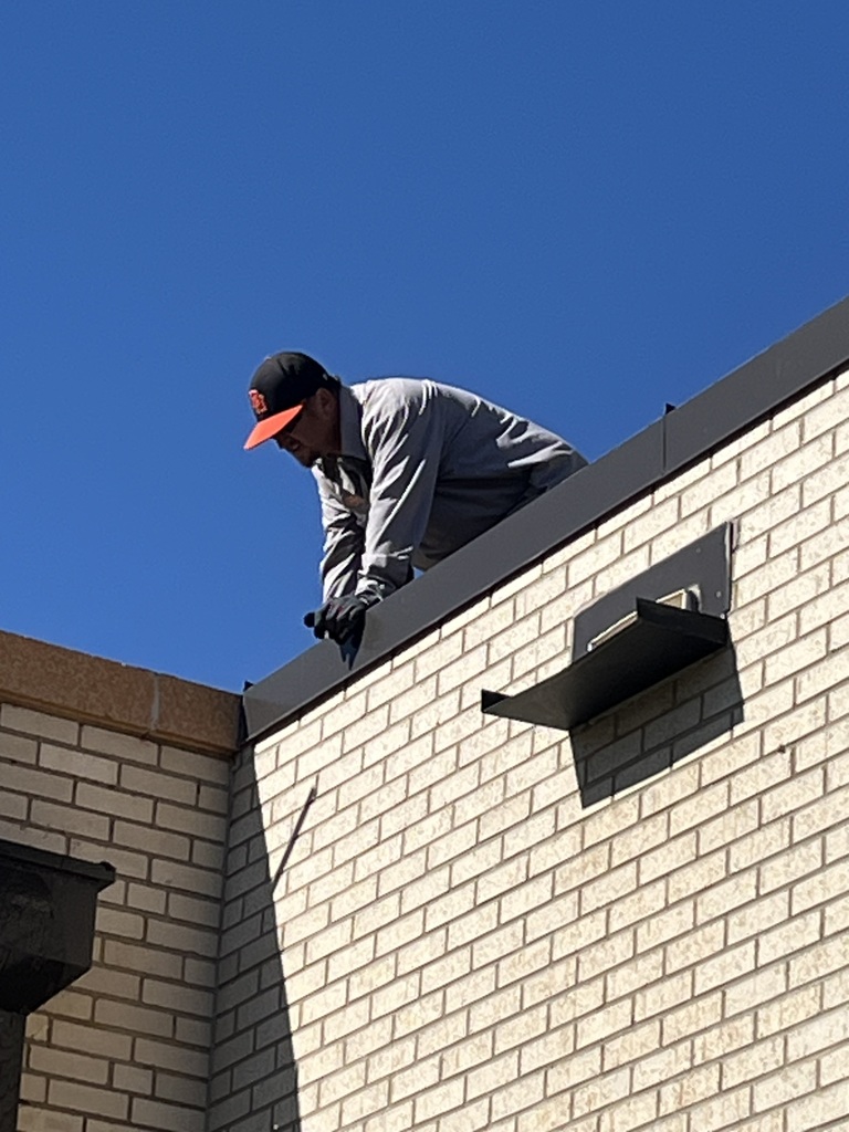 repair man on roof