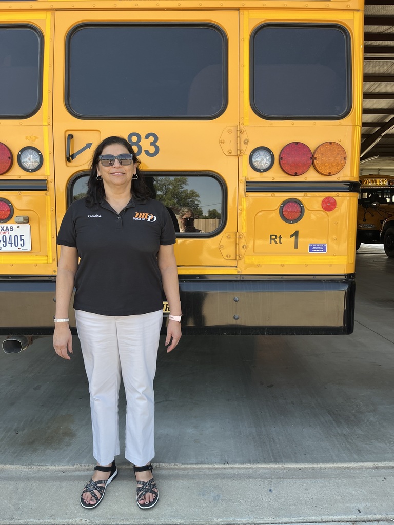 bus driver standing with bus