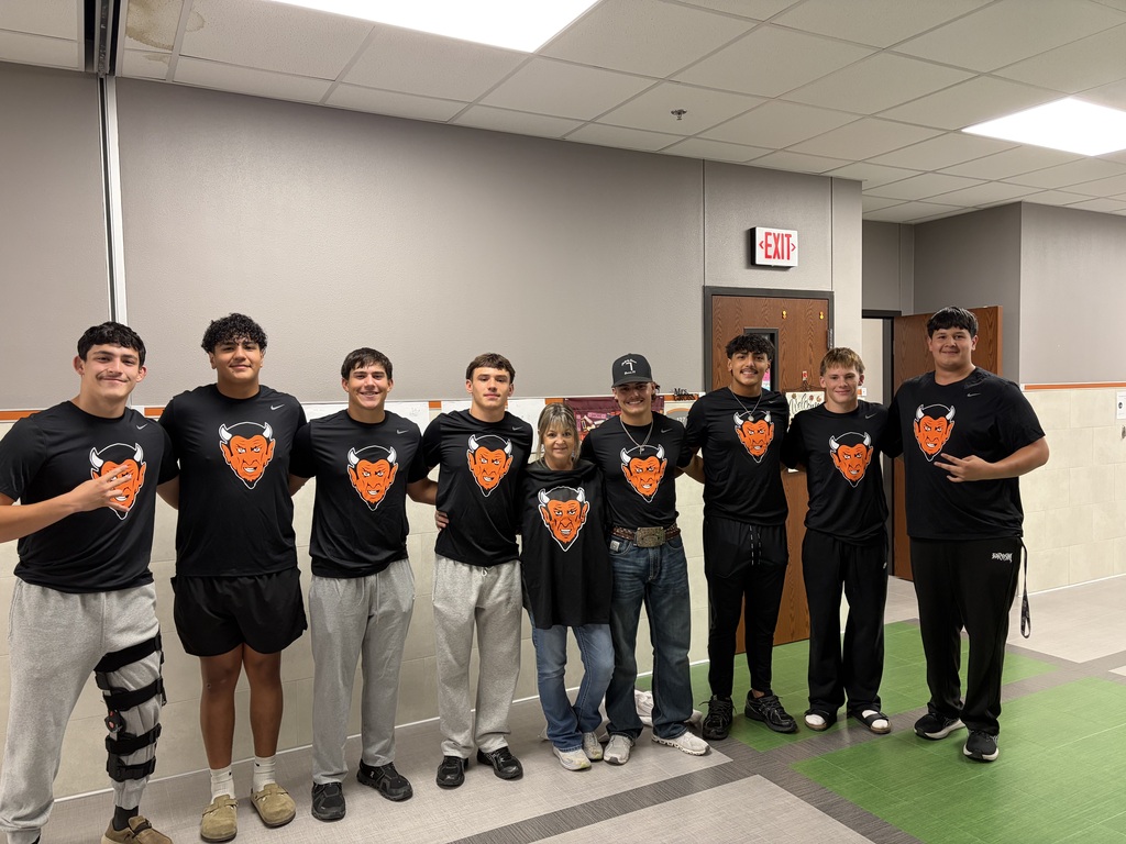 Dumas Football players with Ms Robinette
