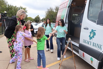 student getting ice cream from the truck