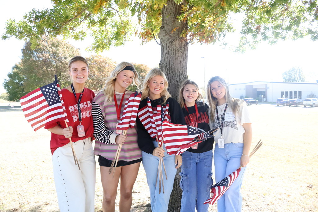 Students holding flags 