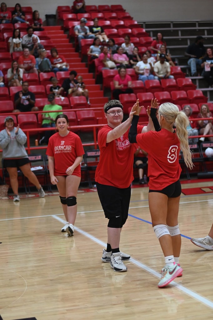 students high fiving 